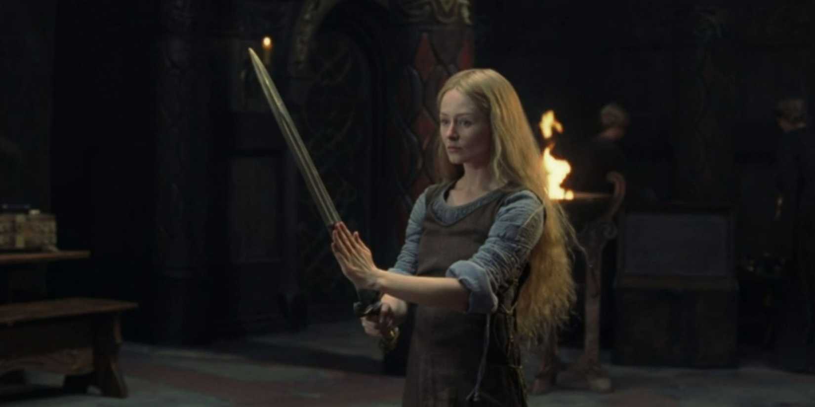 Miranda Otto as Éowyn holding a sword in The Lord of the Rings