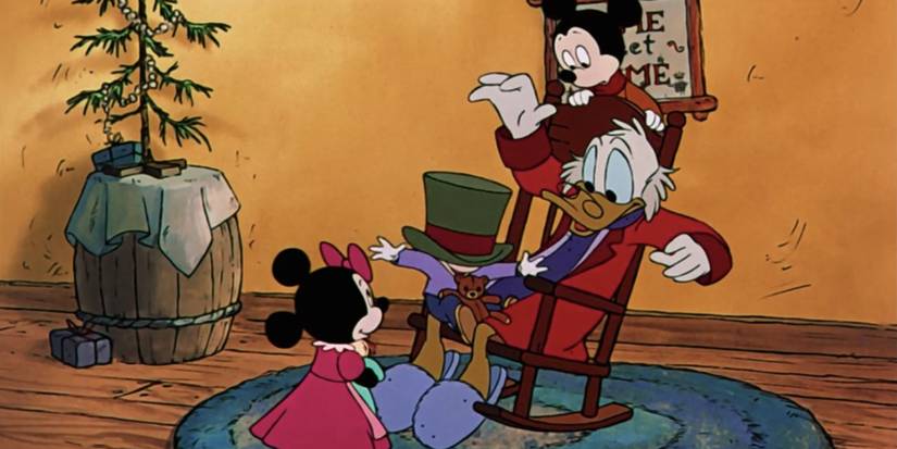 Scrooge McDuck plays with children as he sits in a rocking chair in Mickey's Christmas Carol