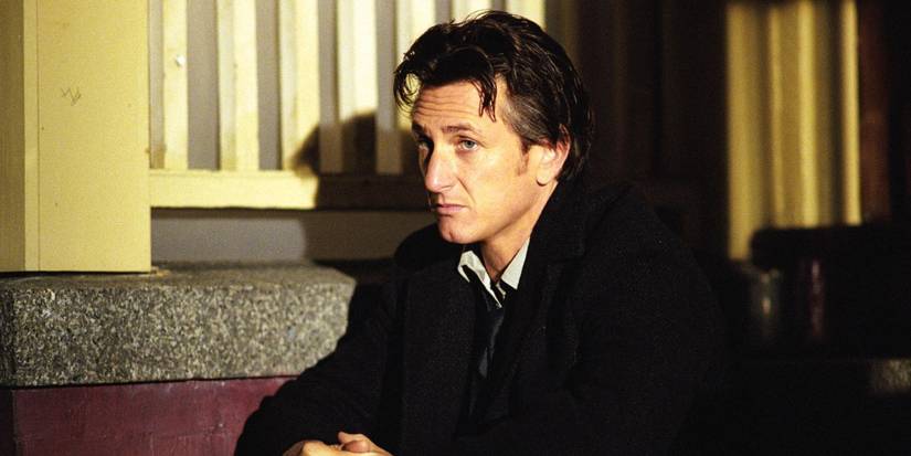 Jimmy Markum (Sean Penn) sits on the steps out the front of a house at night in 'Mystic River' (2003).