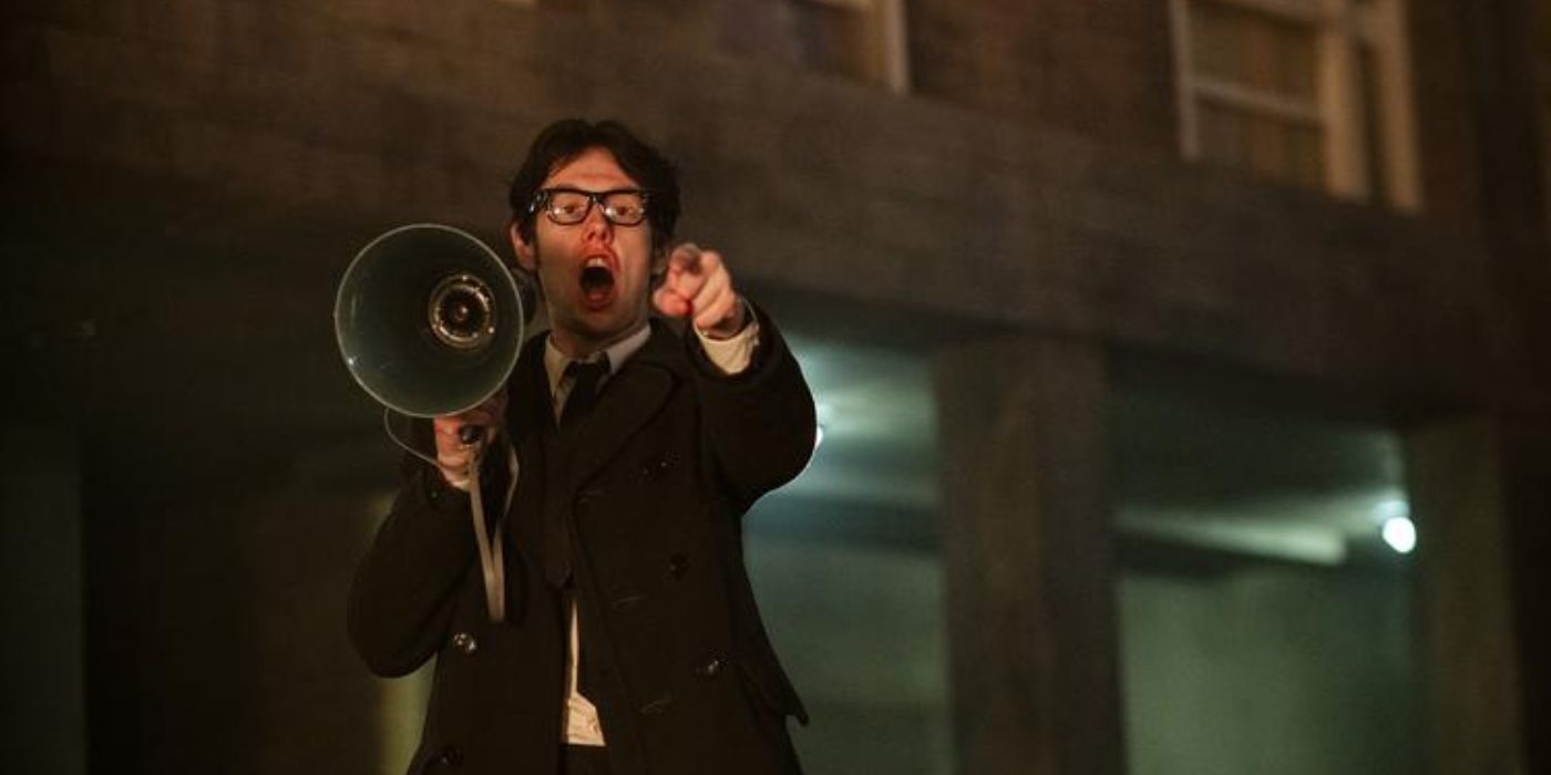 Josh Finan as Gerry Adams holding a megaphone speaker while screaming in 'Say Nothing'