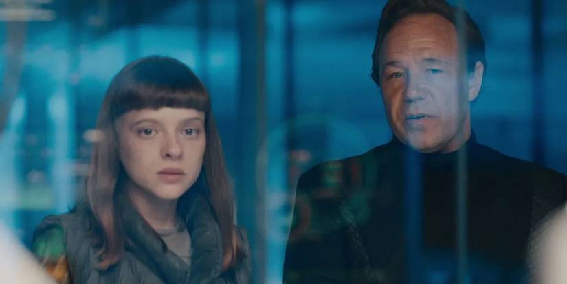 Shira Haas and Stephen Graham look at something behind glass in Bodies.