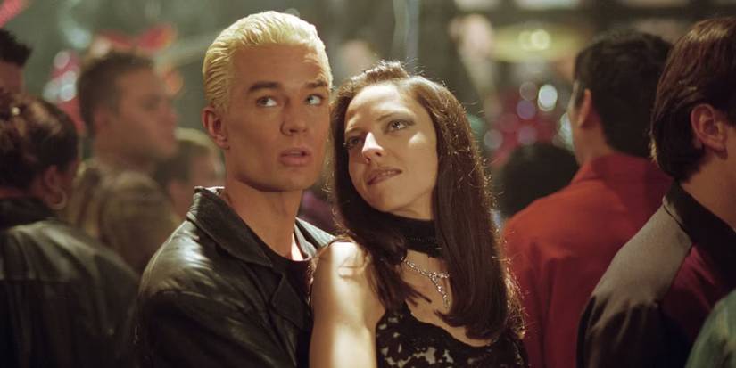 Spike (James Marsters) and Drusilla (Juliet Landau) embrace in a crowd in Buffy the Vampire Slayer.