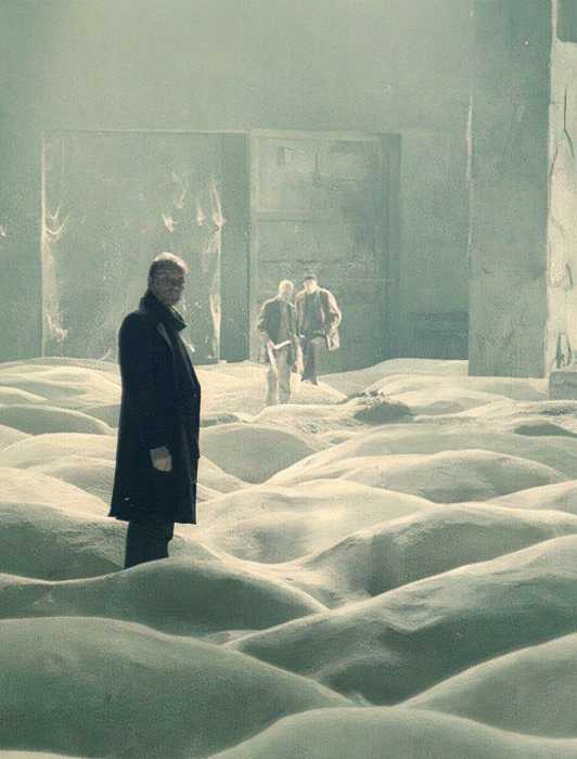 A man standing in a smoky room in Stalker