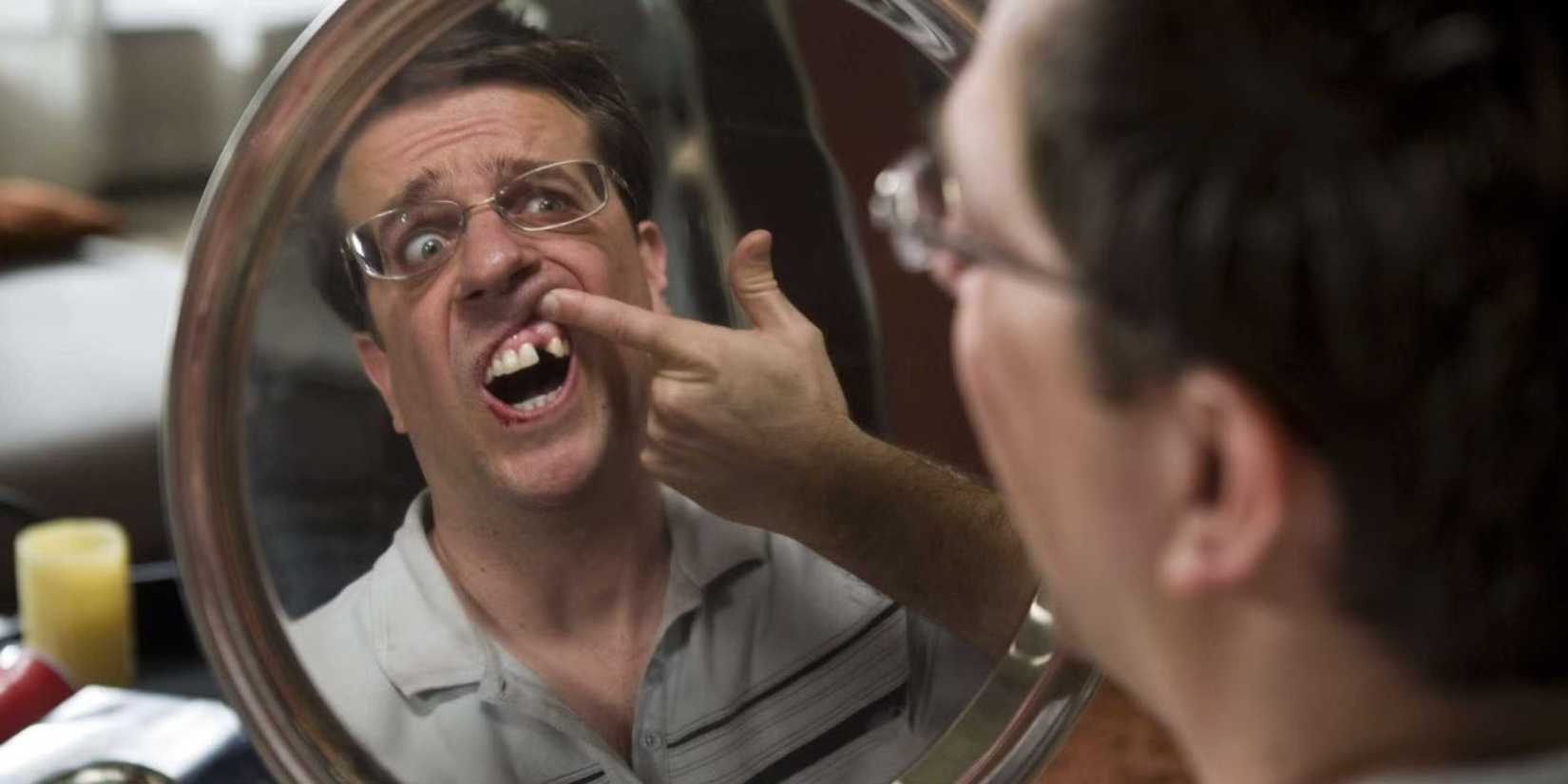 Stu-staring-at-the-gap-in-his-teeth-in-mirror in The Hangover