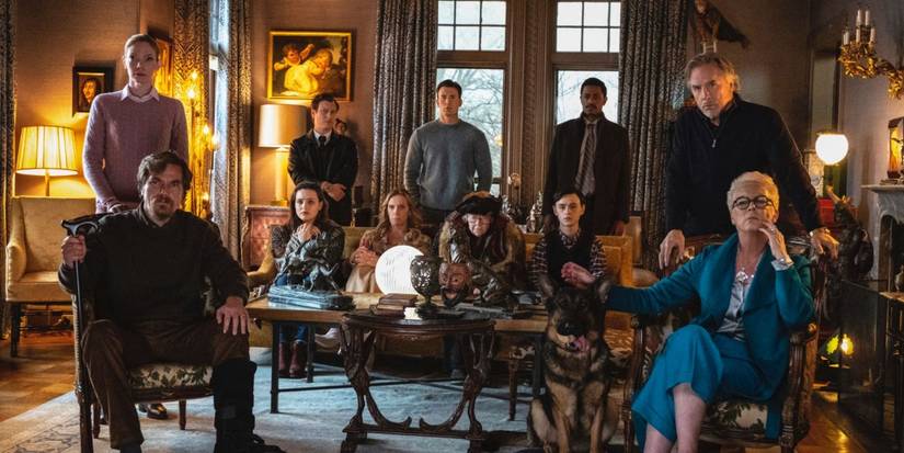 The cast of Knives Out sitting in the drawing room