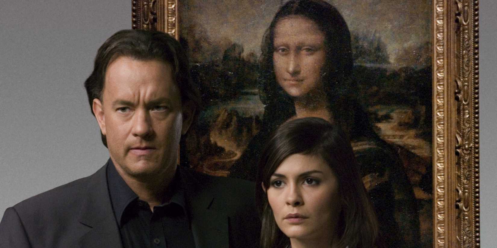 Tom Hanks as Robert Langdon and Audrey Tautou as Sophie Neveu standing in front of the Mona Lisa in The Da Vinci Code