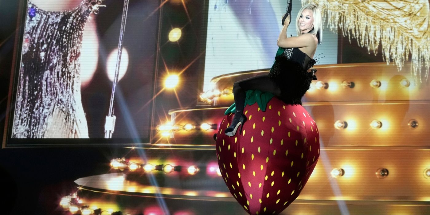 Jenny McCarthy-Wahlberg swings on a strawberry on Miley Cyrus Night of 'The Masked Singer' Season 12.