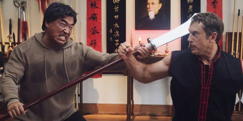 Ron Yuan and Matthew Page sparring with a weapon in 'The Paper Tigers'
