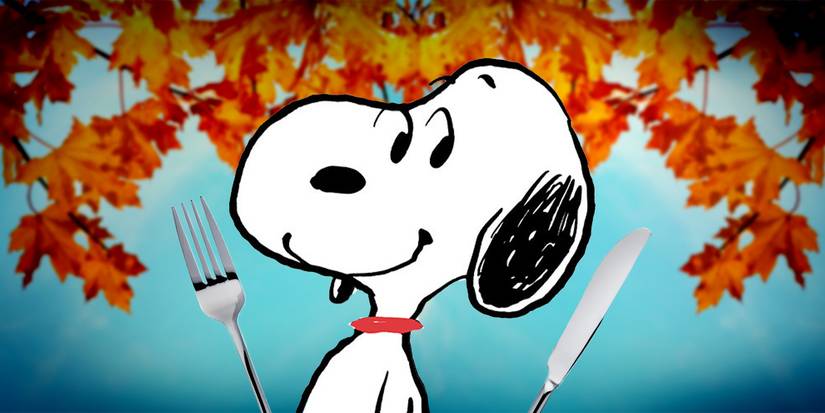 Snoopy with a fork and knife in front of autumn trees from Peanuts