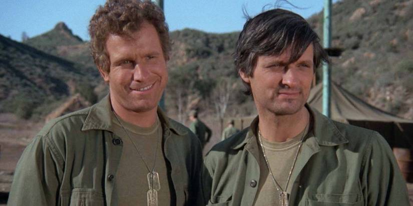 Hawkeye (Alan Alda) and Trapper (Wayne Rogers) standing together in 'MASH' episode "Major Fred C. Dobbs"