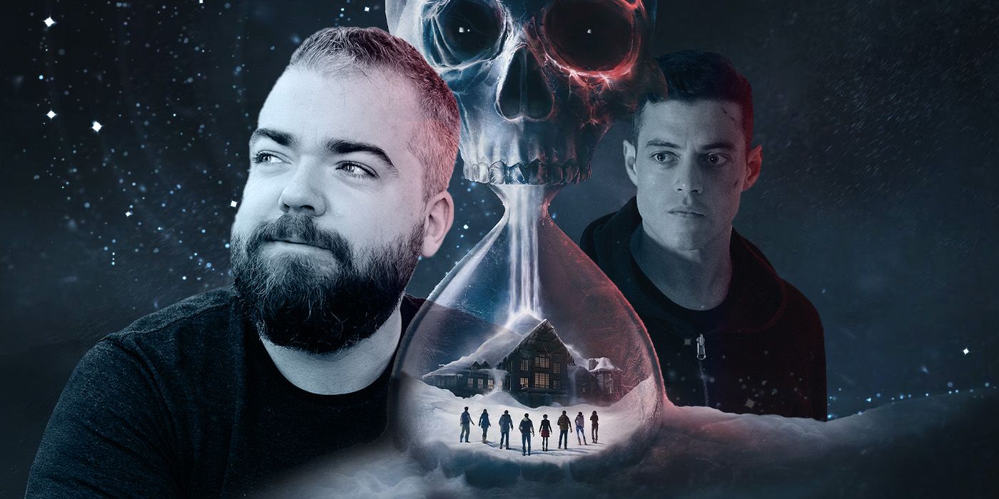 David F. Sandberg and Rami Malek near a snow-covered skully shaped hour glass.