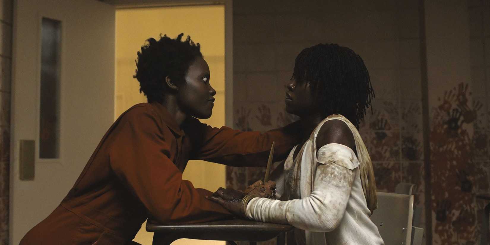 Lupita Nyong'o as both Red and Adelaide fighting in Us