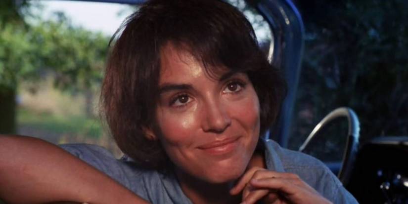 Zohra Lampert as Jessica, smiling behind the wheel of a car, in Let's Scare Jessica to Death