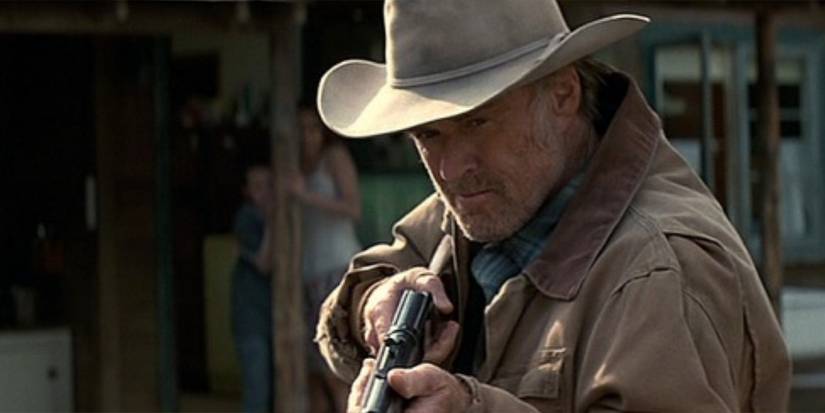 Einar Gilkyson (Robert Redford) pulls a gun to protect his family in 'An Unfinished Life'