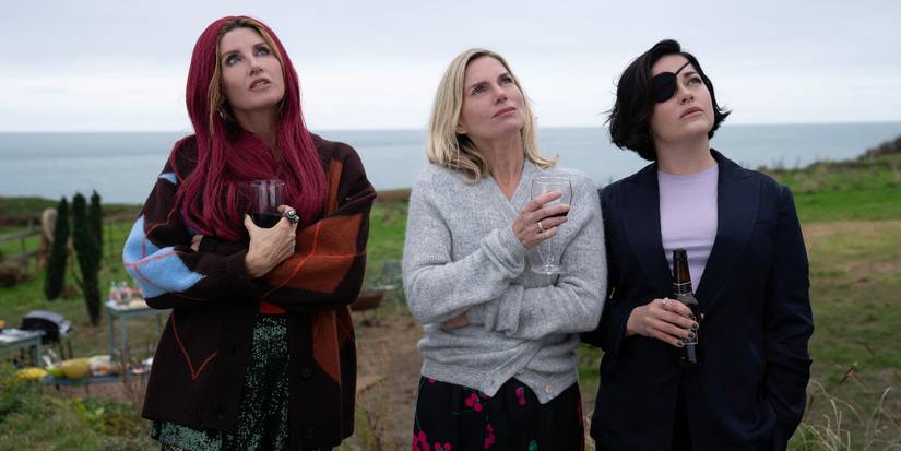 Sharon Horgan, Eva Birthistle, and Sarah Greene holding drinks and looking up in Bad Sisters.