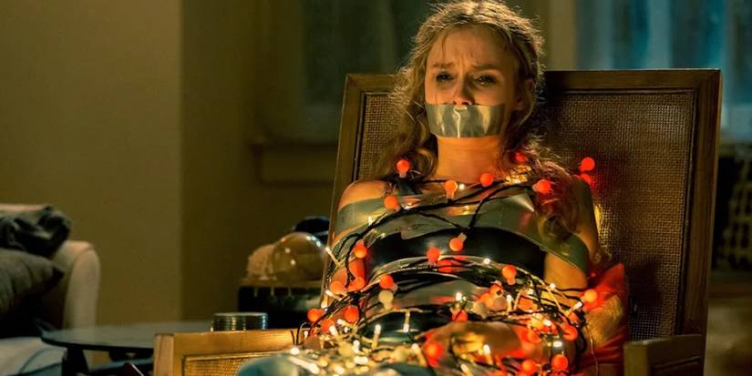 Ashley (Olivia DeJonge) tied up in Christmas lights in 'Better Watch Out'