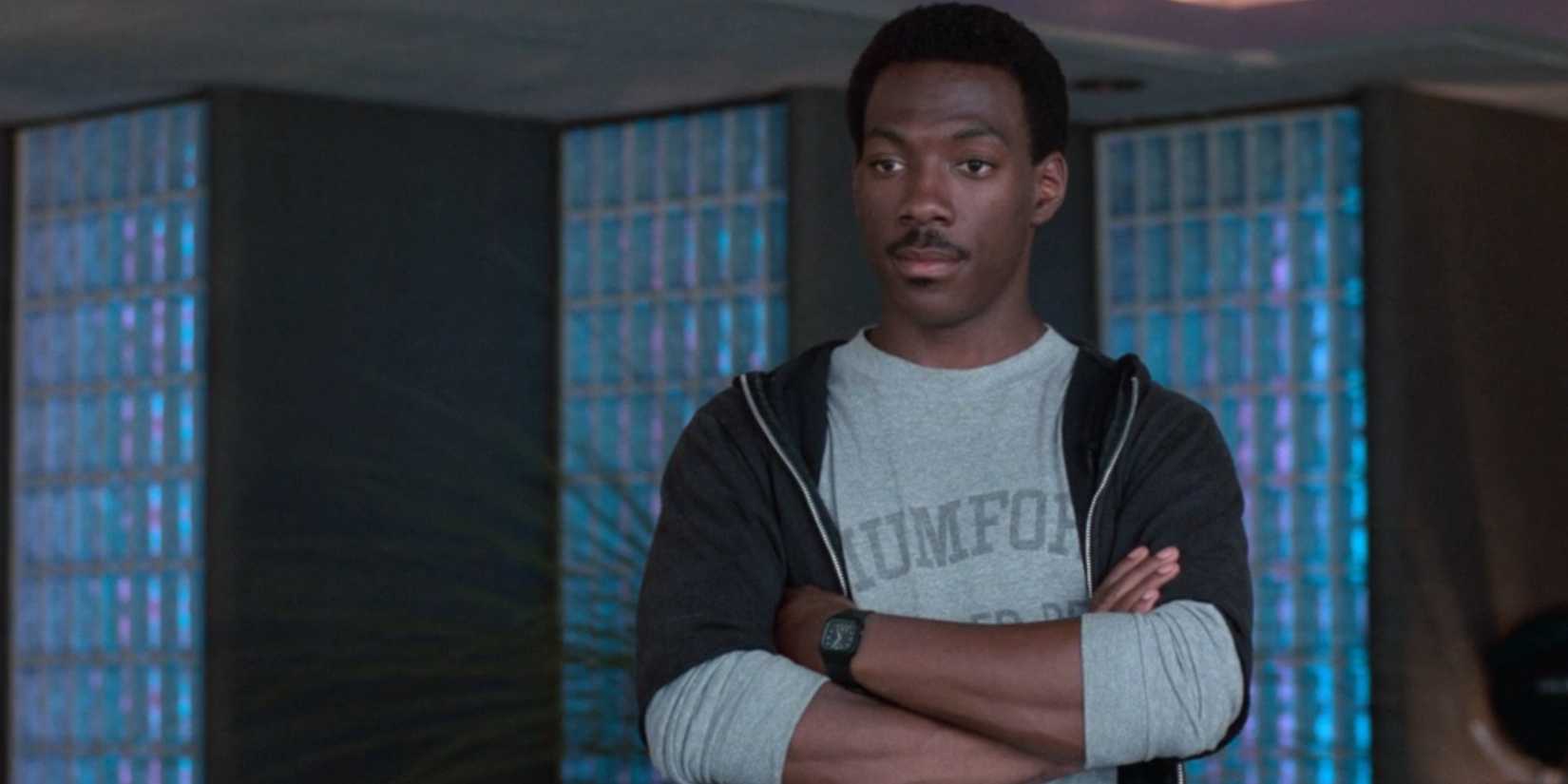 Axel Foley, played by Eddie Murphy, crosses his arms in 'Beverly Hills Cop'.