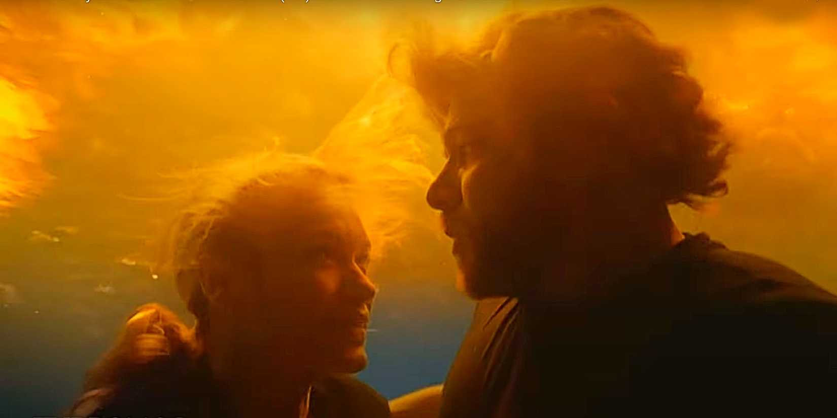Audrey James and Bode Leone hiding from a fire underwater in Fire Country Season 3.