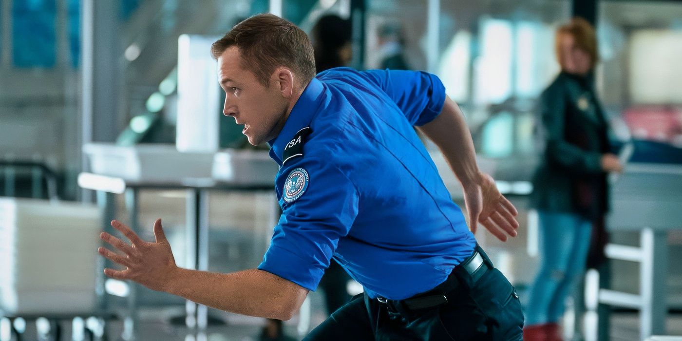Taron-Egerton running through an airport in Carry-On