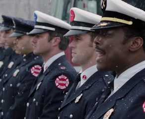 Chief Boden (Eamonn Walker) calls the team to stand at attention in the 'Chicago Fire' episode "A Coffin That Small"