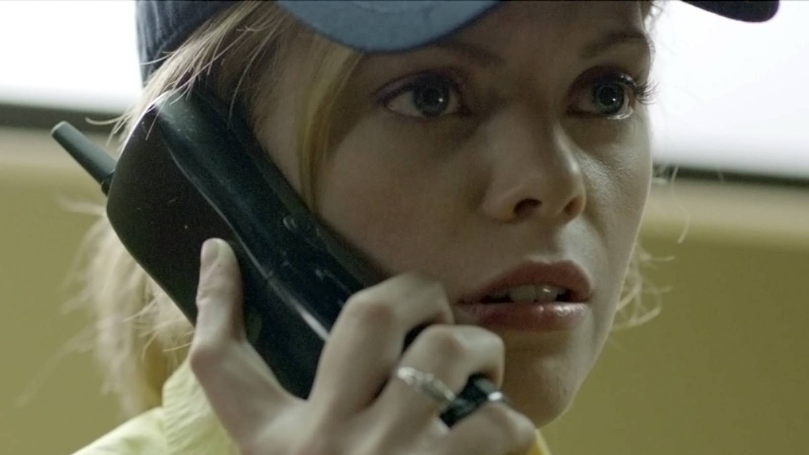 Dreama Walker as Becky making a phone call in Compliance