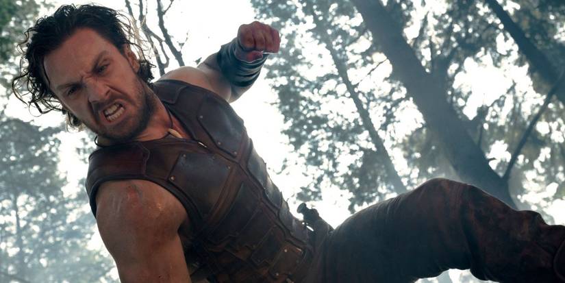 Kraven punching something lying on the ground in Kraven the Hunter