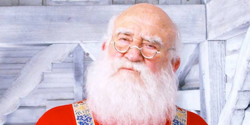 Ed Asner as Santa Claus in a white house in Elf.