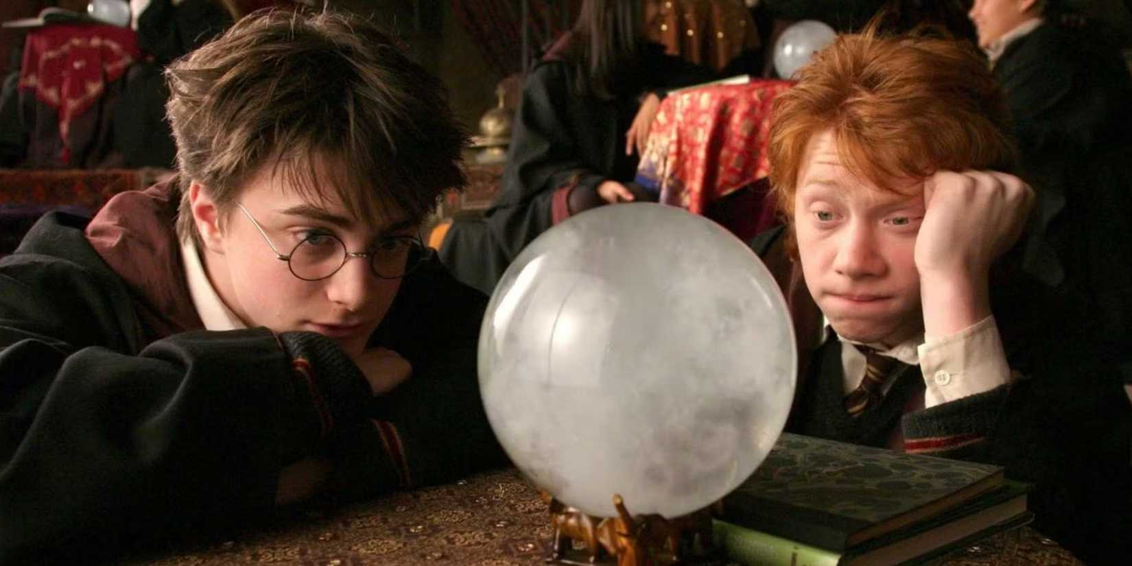 Daniel Radcliffe as Harry and Rupert Grint as Ron stare bored into a crystal ball in Harry Potter and the Prisoner of Azkaban