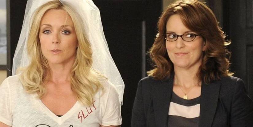 Jane Krakowski as Jenna Maroney in a fake bride veil stands next to Tina Fey as Liz Lemon in 30 Rock.