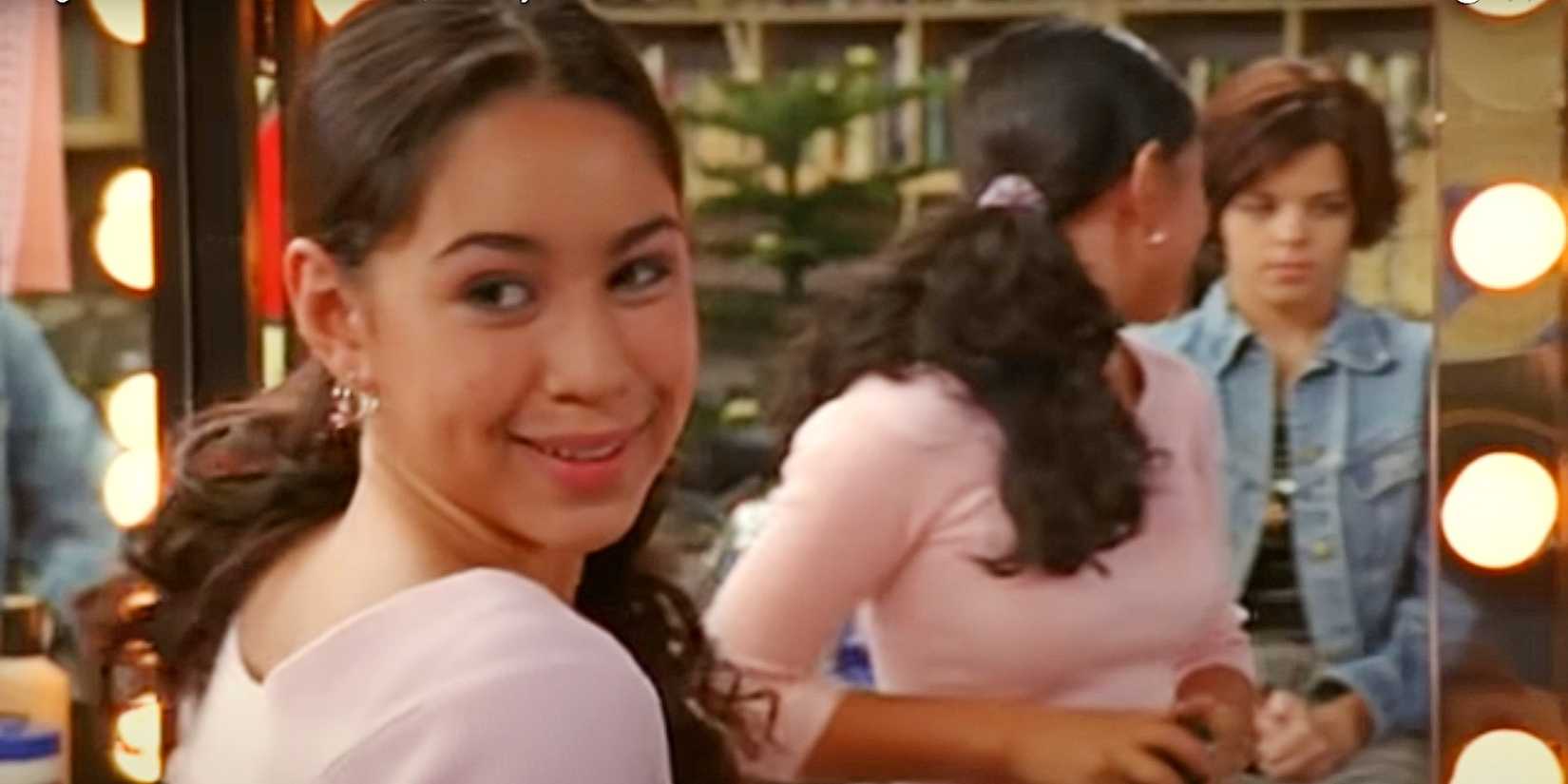 Manny looking at Ashley through a mirror in Degrassi: The Next Generation.