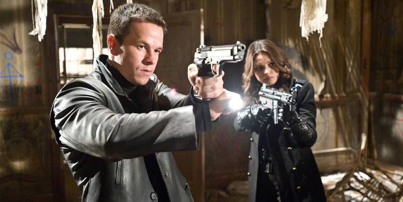 Mark Wahlberg and Mila Kunis with guns at the ready in Max Payne
