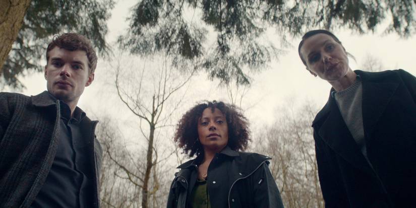 Rosalind Eleazar, Charlie Hamblett, and Catherine Ayers looking down at something in Missing You.