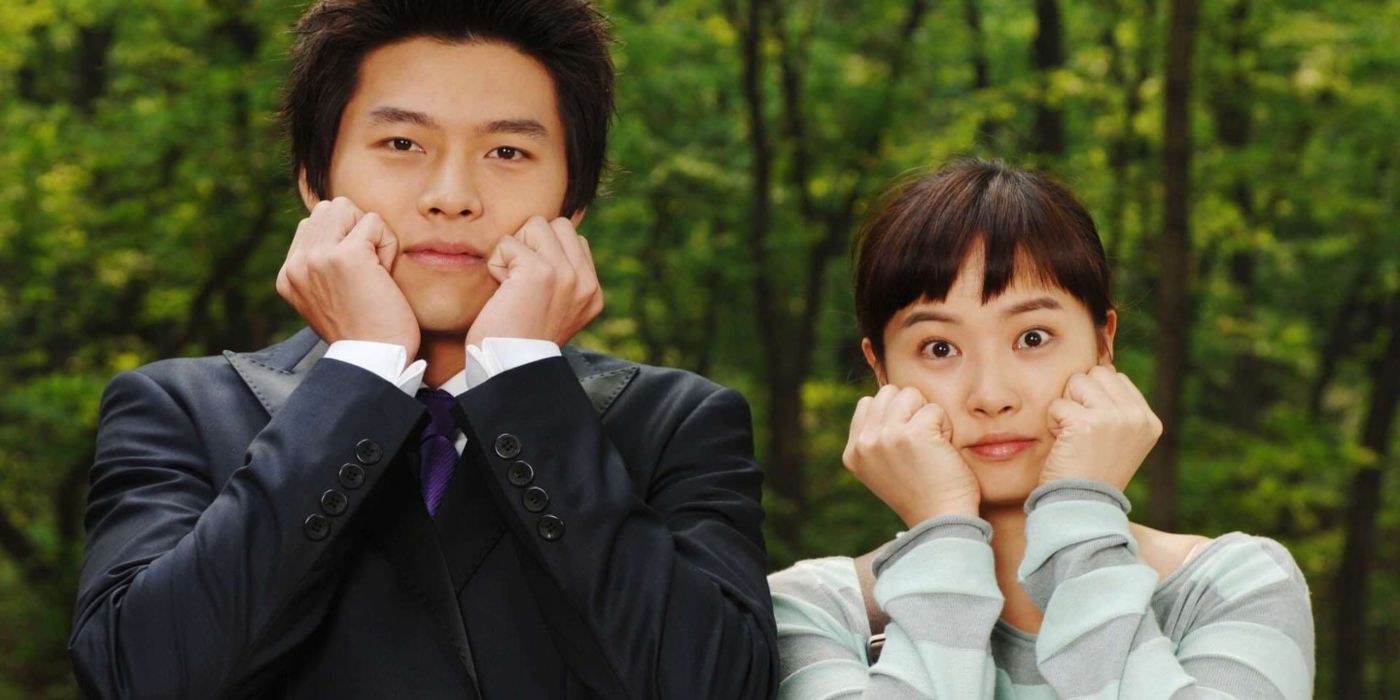 Characters from the K-drama My Lovely Sam Soon pose in front of trees with their hands on their faces.