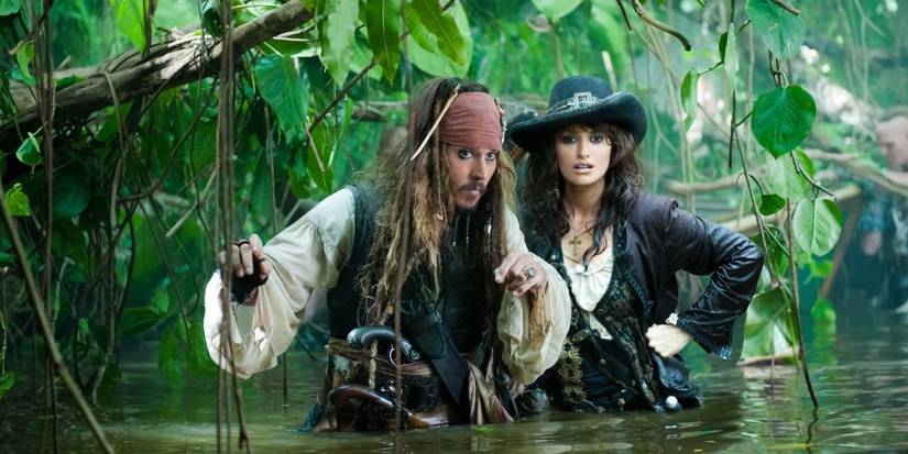 Johnny Depp and Penélope Cruz half-submerged in water in Pirates of the Caribbean: On Stranger Tides