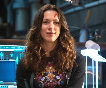 Rebecca Hall as Maya Hansen sitting in front of a computer in 'Iron Man 3'
