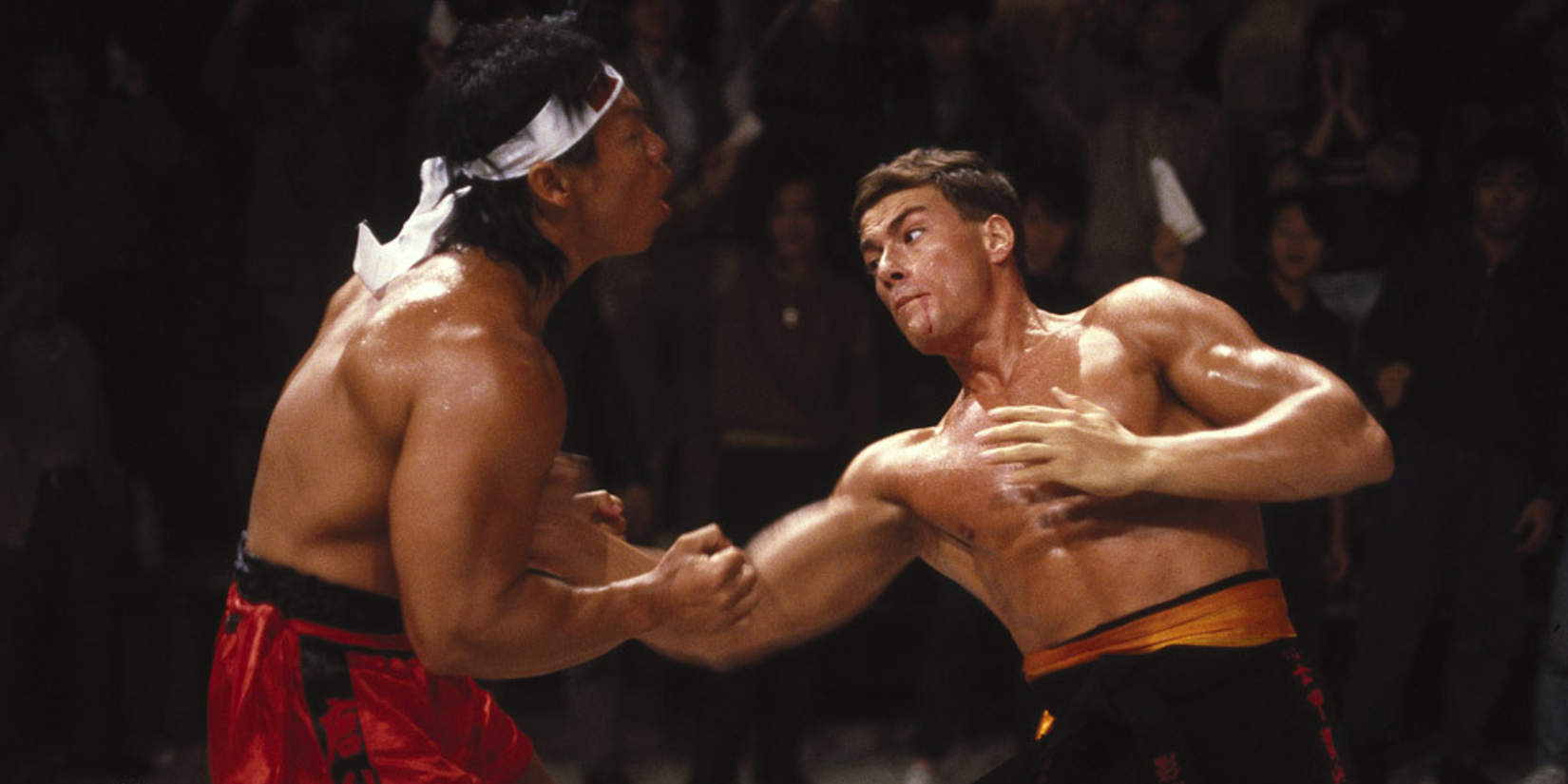 Jean-Claude Van Damme fighting another man in Bloodsport