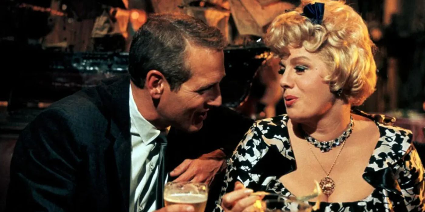 Paul Newman and Shelley Winters as Lew Harper and Fay Estabrook sitting down at a bar holding drink glasses in &lsquo;Harper&rsquo;