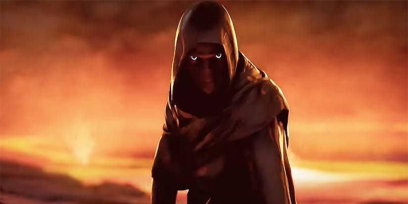 Seorang pria berkerudung dan menyamar berdiri di padang pasir