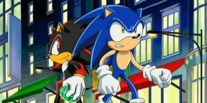 Shadow (Jason Griffith) standing behind Sonic (Jason Griffith) while holding a Chaos Emerald and smiling in Sonic X