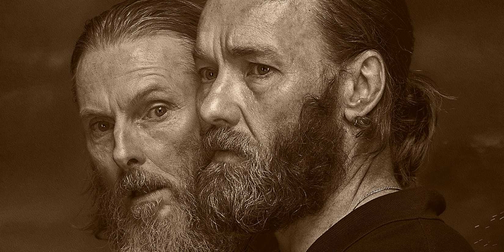 Joel Edgerton looks concerned as Mark, while Sean Harris as Henry looks menacingly over his shoulder in The Stranger.