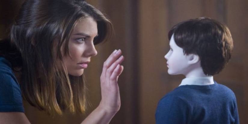 Greta says hello to a doll in The Boy