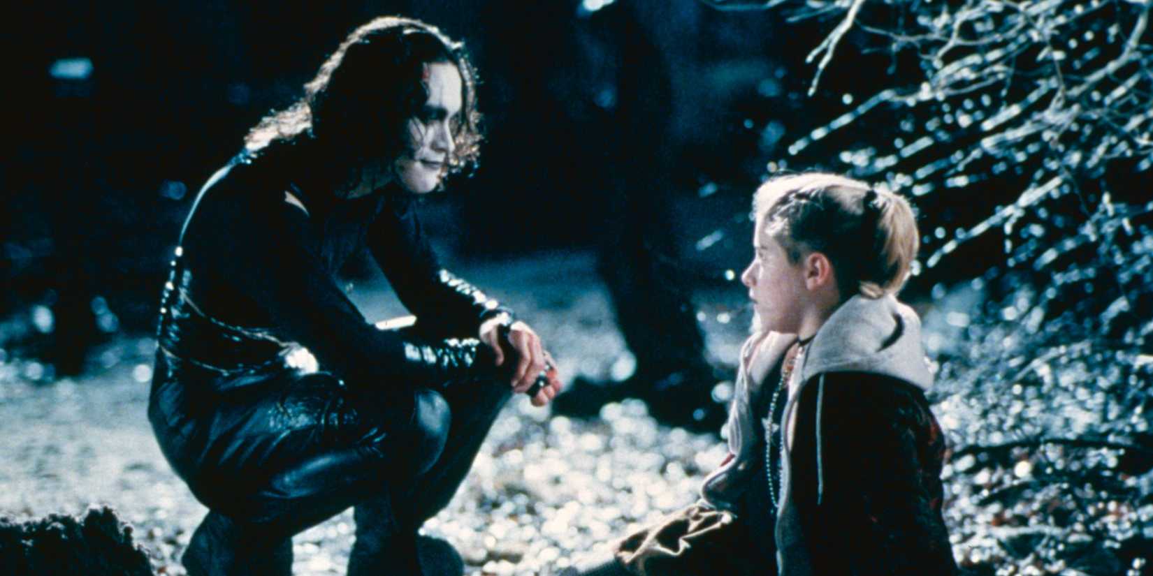Eric Draven (Brandon Lee) talks to a little girl in The Crow 1994