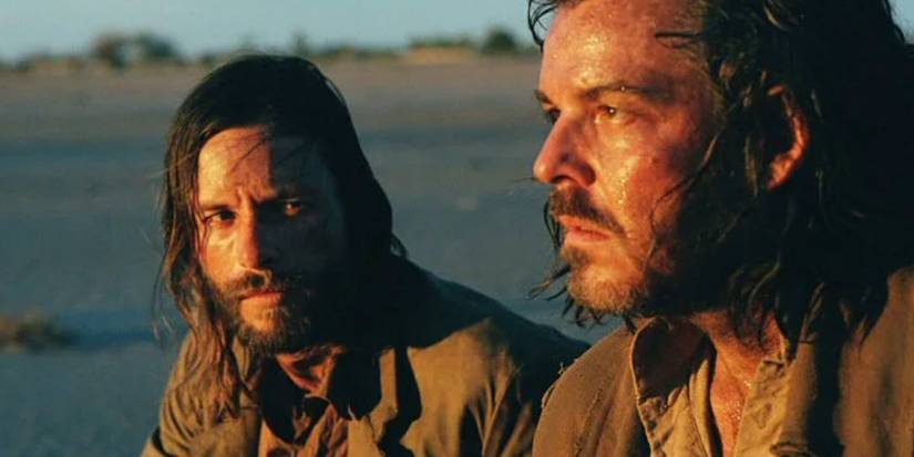 Charlie Burns (Guy Pearce) sits with his dying brother Arthur (Danny Huston) in The Proposition.