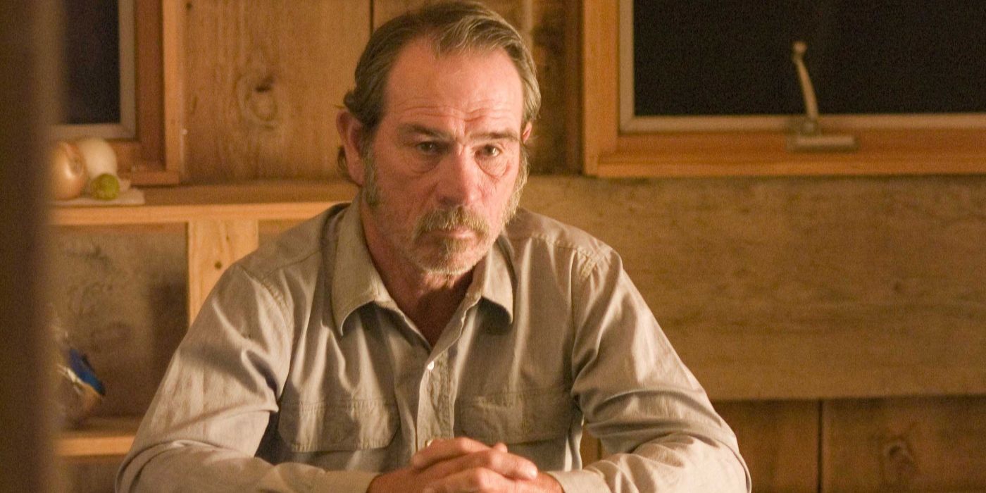 Pete Perkins (Tommy Lee Jones) sits with his hands folded in 'The Three Burials of Melquiades Estrada'