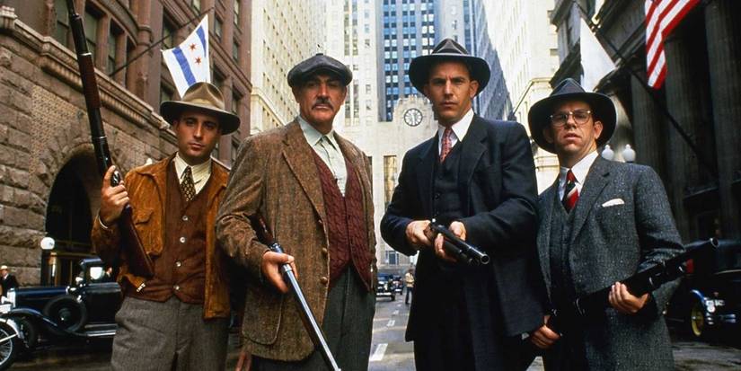 A group of armed men looking at the camera holding weapons in The Untouchables