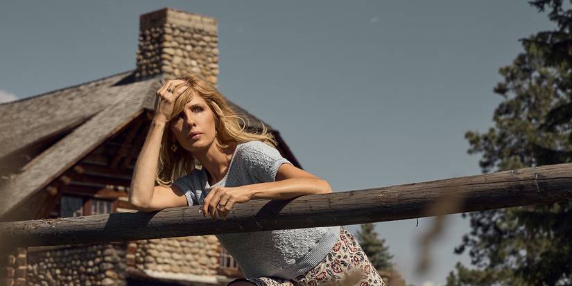 Kelly Reilly as Beth Dutton leans over a fence with her hand on her forehead in Yellowstone Season 5 Part 2.