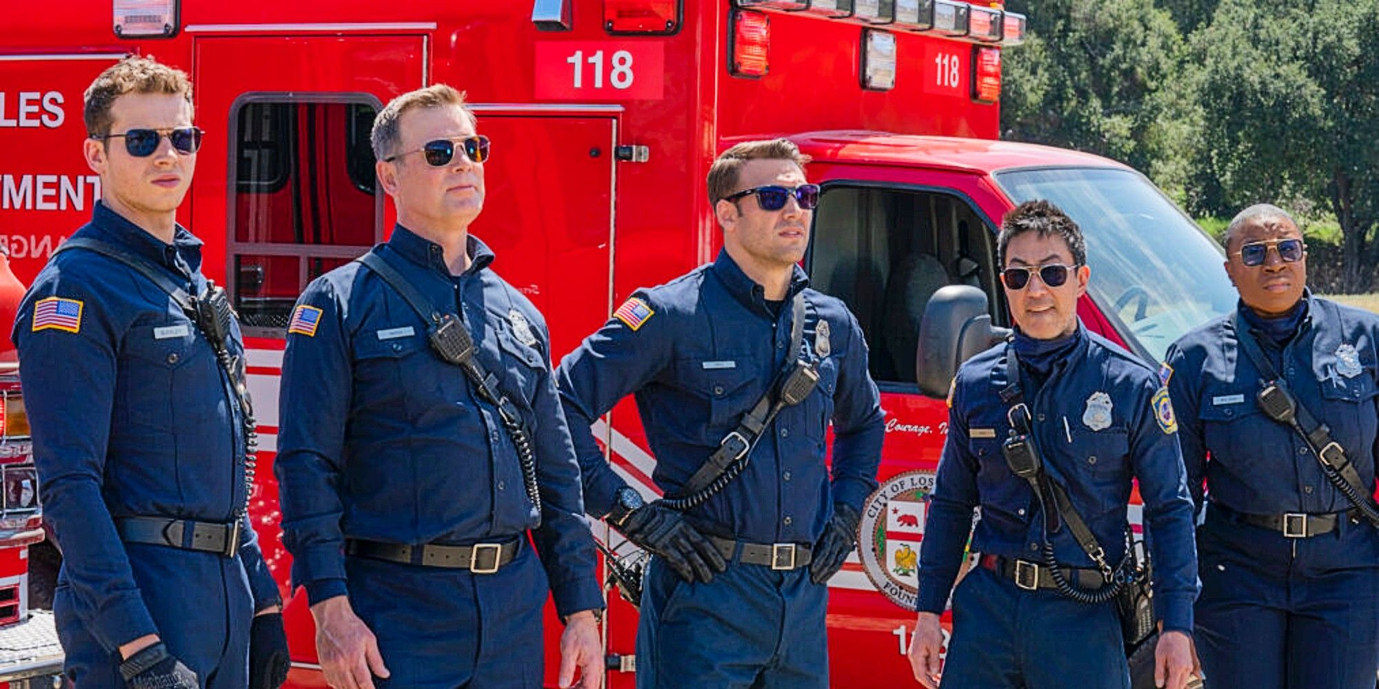 Buck, Bobby, Eddie, Chimney, and Hen standing in front of a firetruck in 9-1-1 Season 8.