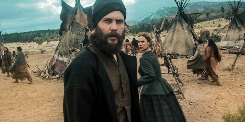 Taylor Kitsch and Betty Gilpin near teepees in American Primeval.