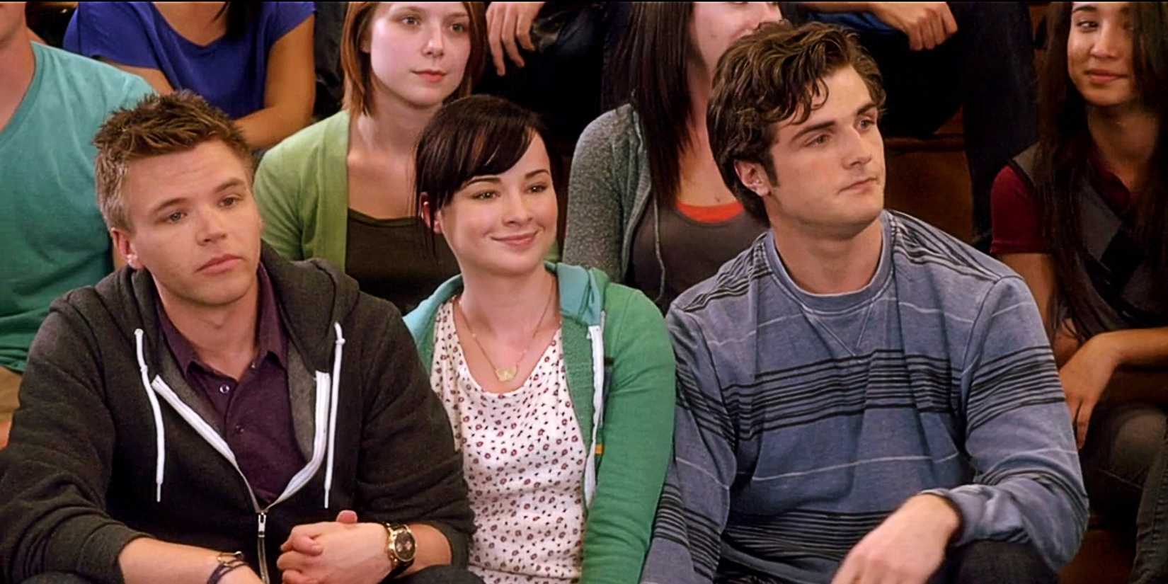 Jake Rosati, Jenna Hamilton, and Matty McKibben sitting at a pep rally together in Awkward.