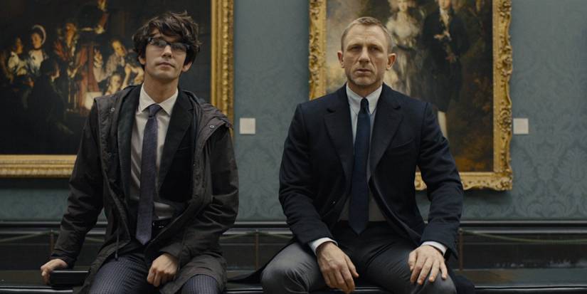 Ben Whishaw and Daniel Craig sitting at the National Gallery next to each other and talking about something they're looking at in front of them